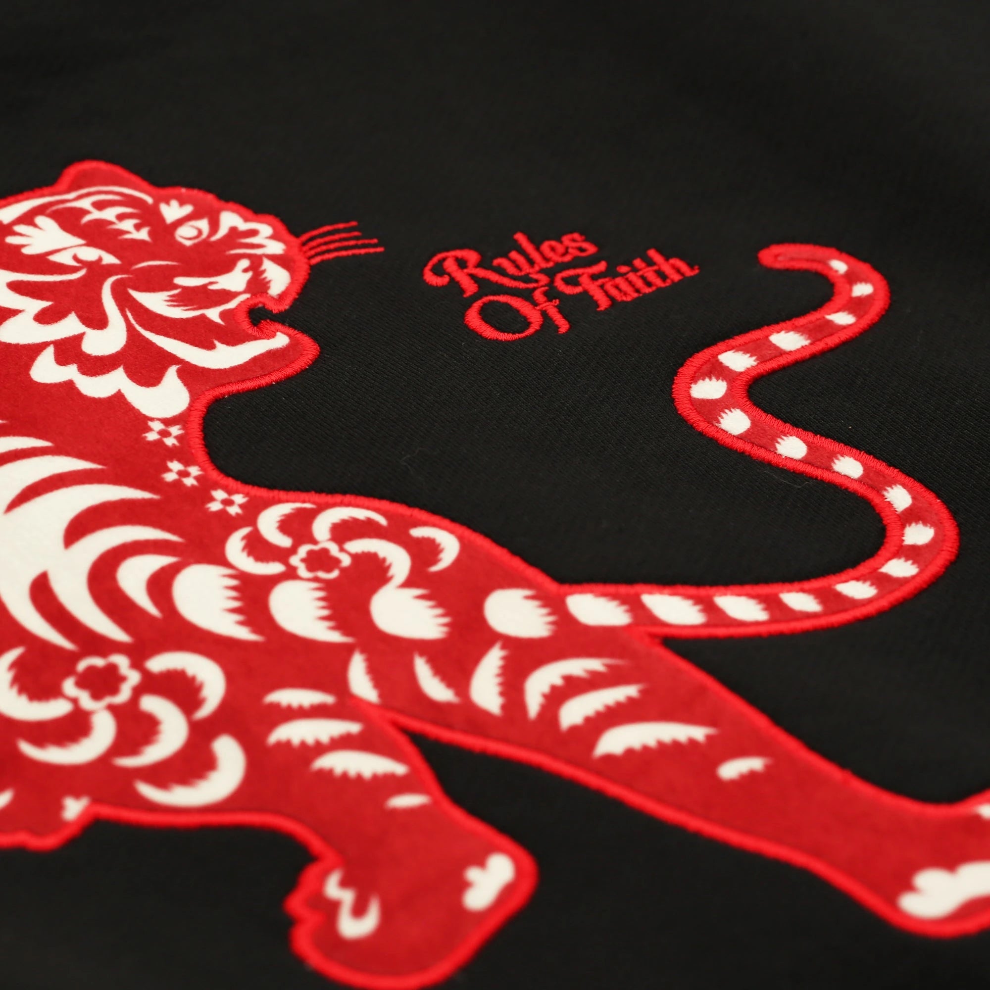 Back tiger appliqué and Rules of Faith embroidery