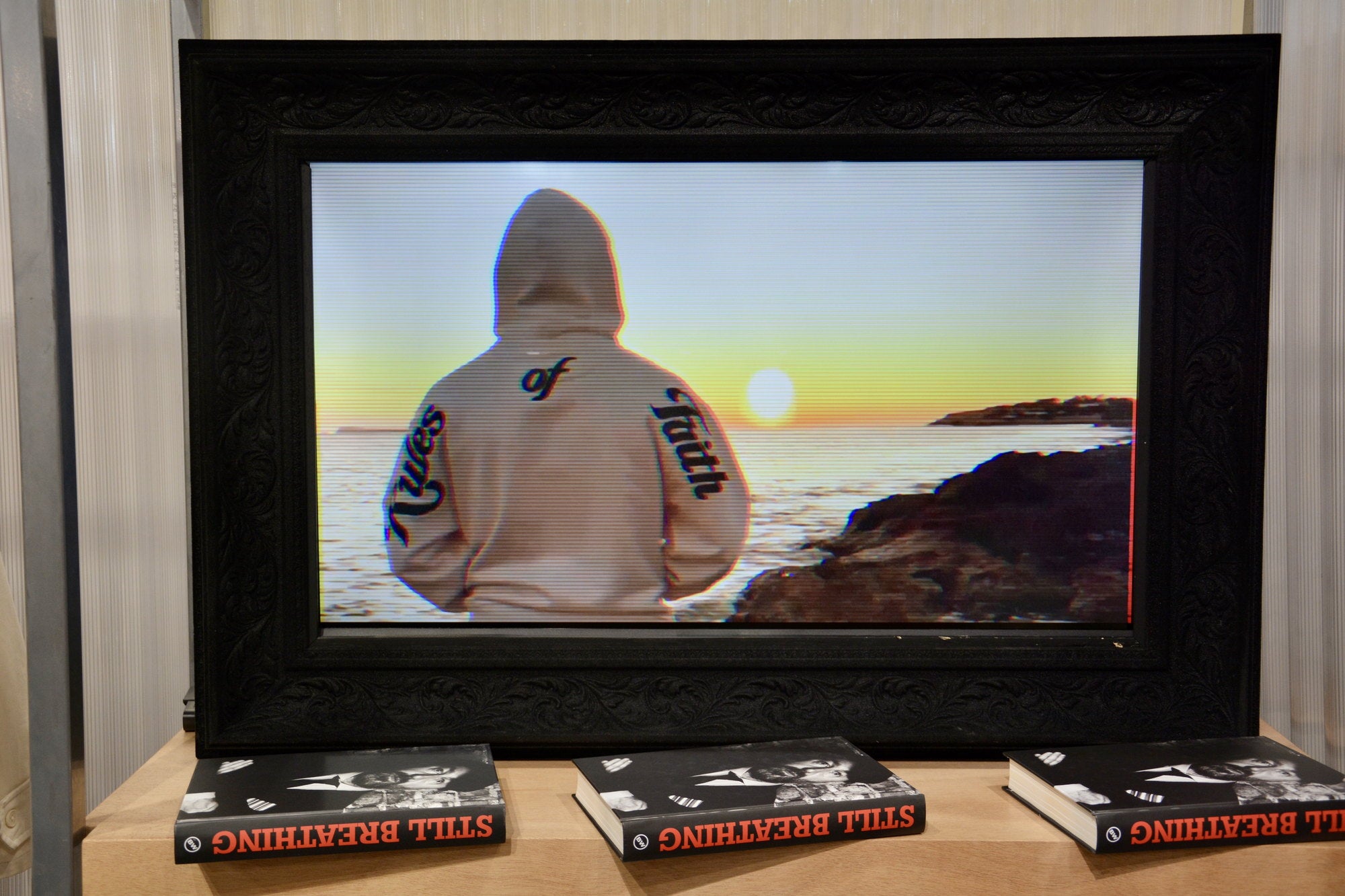 Framed campaign still at Pitti Uomo